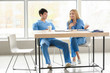 © Pixel-Shot - Young medical assistants having break during work in clinic