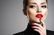 © Valua Vitaly - Beautiful woman with bright make-up and red nails.