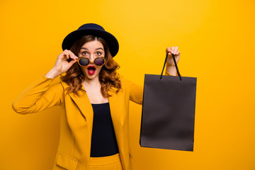 Close up photo beautiful she her lady black friday hold carry packs perfect look buy buyer present gift birthday low prices wear specs formal-wear costume suit isolated yellow bright background