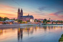 Magdeburg, Germany. Cityscape Image Of Magdeburg, Germany With Reflection Of The City In The Elbe River, During Sunset.