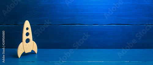 A Wooden Rocket On A Blue Background The Style Is Retro The