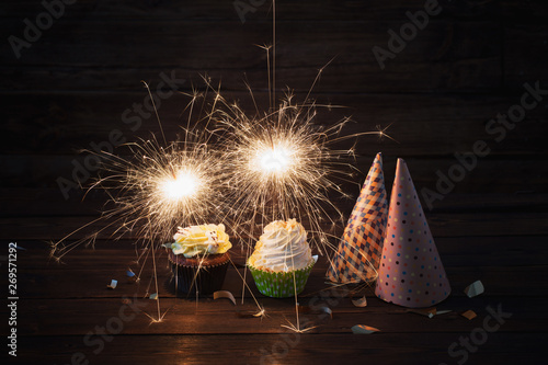 Cuadros en Lienzo birthday cake with sparkler on old wooden background