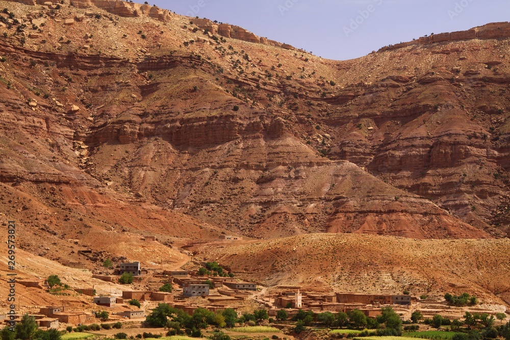 High Ruggedness Old berber village oasis with houses build of clay bricks in front of ...