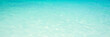 Blue turquoise translucent water ocean panoramic background, pristine water in a tropical lagoon, travel header and web banner