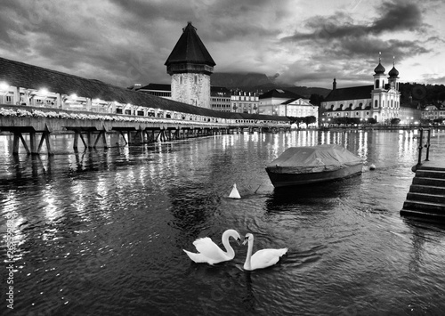 Chapel Bridge and Water Tower at night with swans on Lake Lucerne, Lucerne, Swit Poster Mural XXL