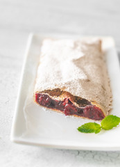 Poster - Cherry strudel on the white plate