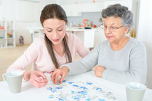 Family Doing Memory Training Together With Mazes And Sudoku Puzzles