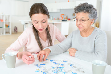 family doing memory training together with mazes and sudoku puzzles