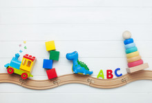 Kids Toys On Toy Wooden Railway On White Wooden Background With Copy Space
