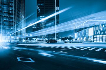 abstract image of blur motion of cars on the city road at night，Modern urban architecture