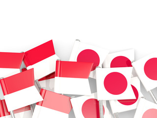 Pins with flags of Indonesia and japan isolated on white.