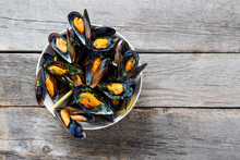 Delicious Seafood Mussels With  Parsley Sauce And Lemon.
