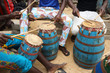 Close-up of a musician playing traditional drums on the beach in Accra, Ghana