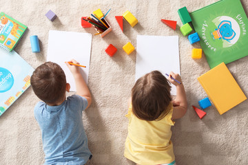 Sticker - Little children drawing indoors, top view. Learning and playing