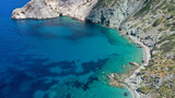 Fototapeta Boho - Aerial drone photo of deep turquoise crystal clear sea and rocky sea shore, Folegandros island, Cyclades, Greece