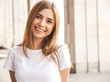 Portrait of beautiful smiling blond model dressed in summer hipster clothes. Trendy girl posing in the street background. Funny and positive woman having fun