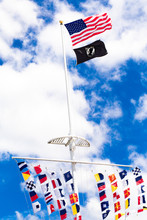 American,  POW  And Colorful Marine Signal Flags Wave On Pole At The Central Mall At Jones Beach State Park, Long Island New York