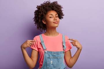 people, pride, arrogance concept. self assured proud woman has afro hairstyle satisfied with own hig