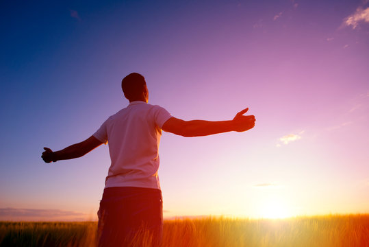 Man feeling free in a beautiful natural setting.