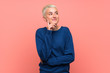 © luismolinero - Teenager girl with white short hair over pink wall thinking an idea while looking up