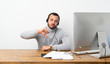 © luismolinero - Telemarketer Colombian man showing thumb down with negative expression