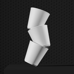 Wall Mural - Stack of white paper cups falling on black table