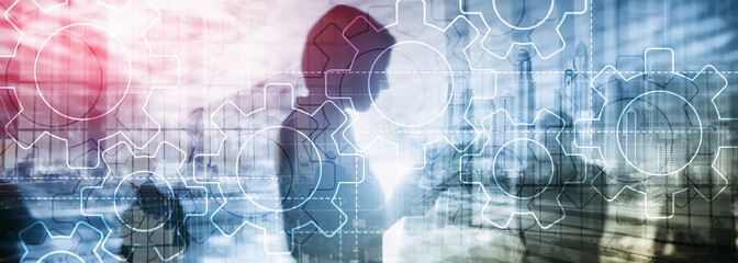Wall Mural - double exposure gears mechanism on blurred background. business and industrial process automation co