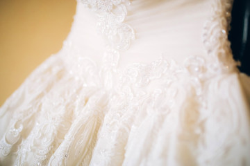 white lace embroidered with stones and rhinestones. luxury wedding dress.