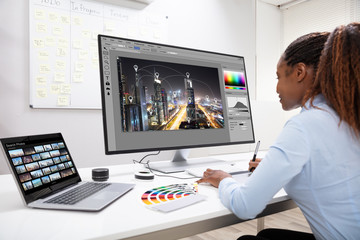 Wall Mural - Designer Editing Photos On Computer