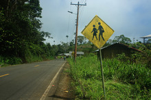 Sign Next To Road In A Little Village Telling That There Is A School And Children Present
