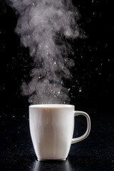 Wall Mural - White mug and water vapor. Freshly brewed hot drink.