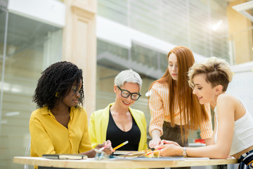 Wall Mural - attractive mixed race girls making up slogan of company. advertising campaign, agency