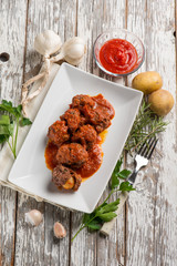 Poster - meatball with tomatoes sauce filled with potatoes