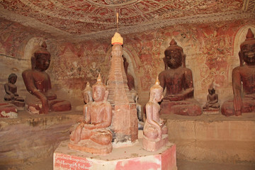 Painting on the walls and old Buddha statues in Pho Win Taung Caves, Monywa city, Sagaing State, Myanmar, Asia.