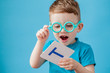© volody10 - Cute little boy with letter on background. Child learn letters. Alphabet
