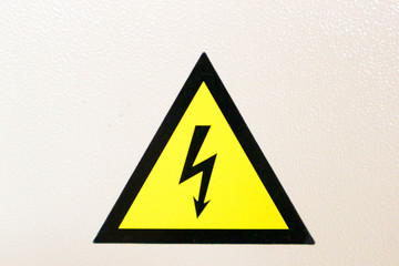 yellow high voltage warning sign on white background