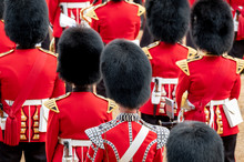 Close Up Of Soldiers Marching At The Trooping The Colour Military Parade At Horse Guards, London UK. Guards Are Wearing Iconic Black And Red Uniform And Bearskin Hats.