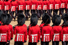 Close Up Of Soldiers Marching At The Trooping The Colour Military Parade At Horse Guards, London UK. Guards Are Wearing Iconic Black And Red Uniform And Bearskin Hats.