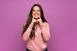 © luismolinero - Teenager girl over purple wall smiling with a happy and pleasant expression