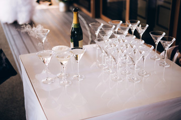 Wall Mural - The waiter pours champagne to a party. glasses of champagne.