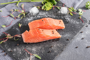 fresh raw salmon fillet with aromatic herbs spices