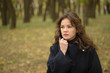 © Vitaly - portrait of worried young woman in autumn park