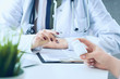 © cameravit - Female doctor hands gives jar of pills to patient hand closeup.