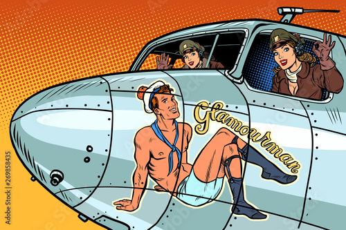 Cuadros en Lienzo women pilots girls. Pinup man on the fuselage of a retro bomber