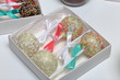 © f2014vad - Cake pops decorated with a bow of braid, packed in a gift box.