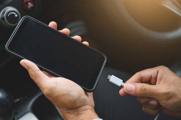 Charging smart phones in the car.