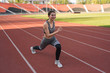 © Павел Костенко - Beautiful athletic girl warming up before a hard workout at the stadium