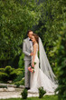 © Wedding photography - Wedding, marriage. Bride and groom in love. Newlywed couple embracing in park.