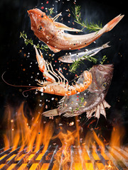 Wall Mural - Kettle grill with fire flames, cast iron grate and tasty sea fishes flying in the air. Freeze motion barbecue concept.