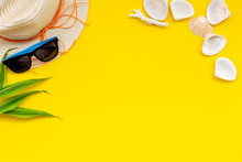 Summer Travaling To The Sea With Straw Hat, Sun Glasses, Shells On Yellow Background Top View Mock Up
